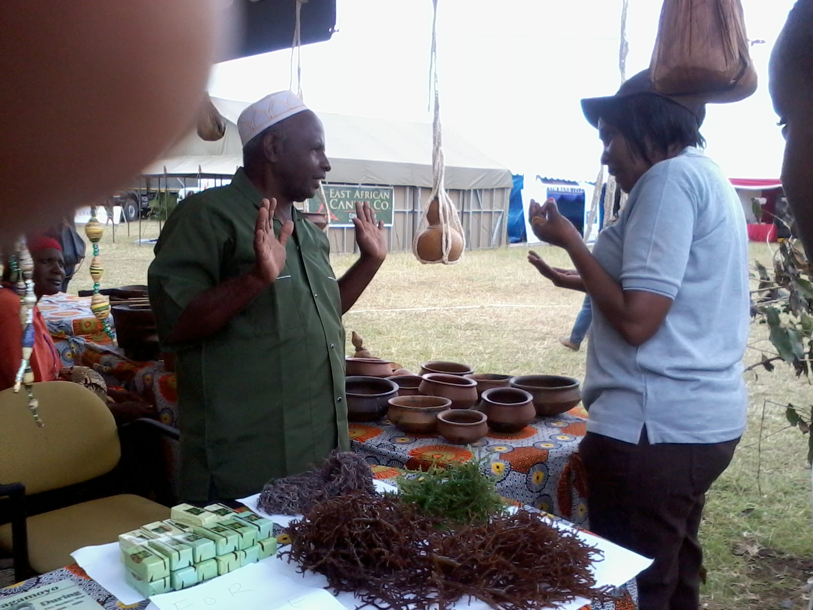 Seaweed farmer explaining something to one of the Officer from the Ministry of Tourism.jpg